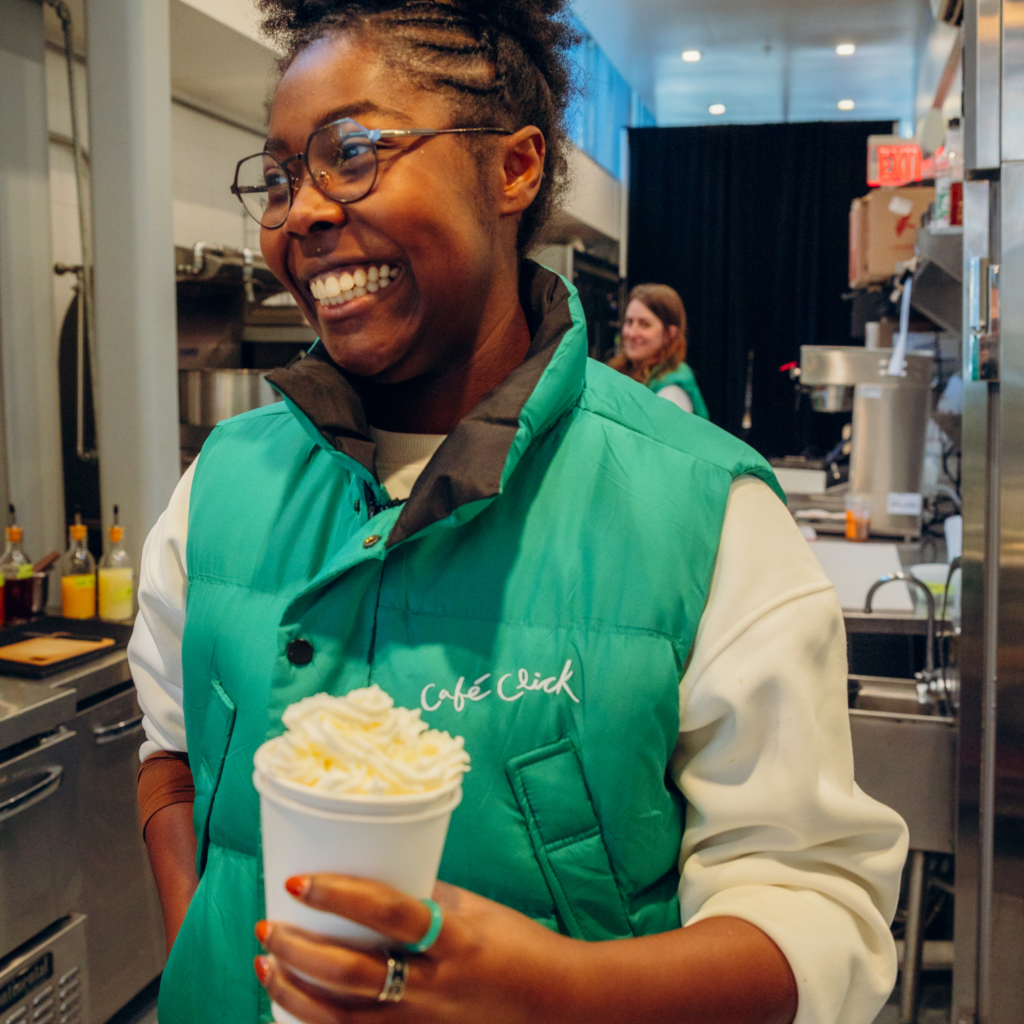 Women Smiling holding Hot Chocolate